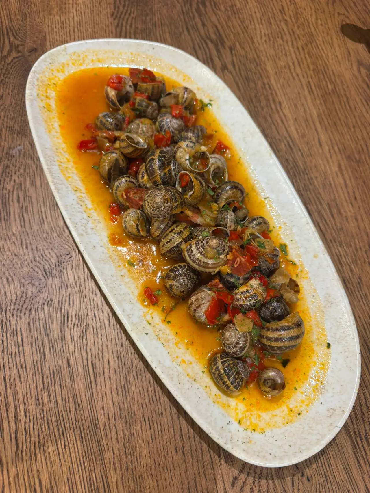 Ración de caracoles en salsa del Restaurante Tres Hermanos, Móstoles